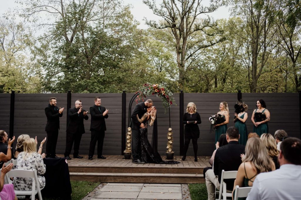 Ceremony photo from a Warehouse 109 wedding with the wedding party wearing all black