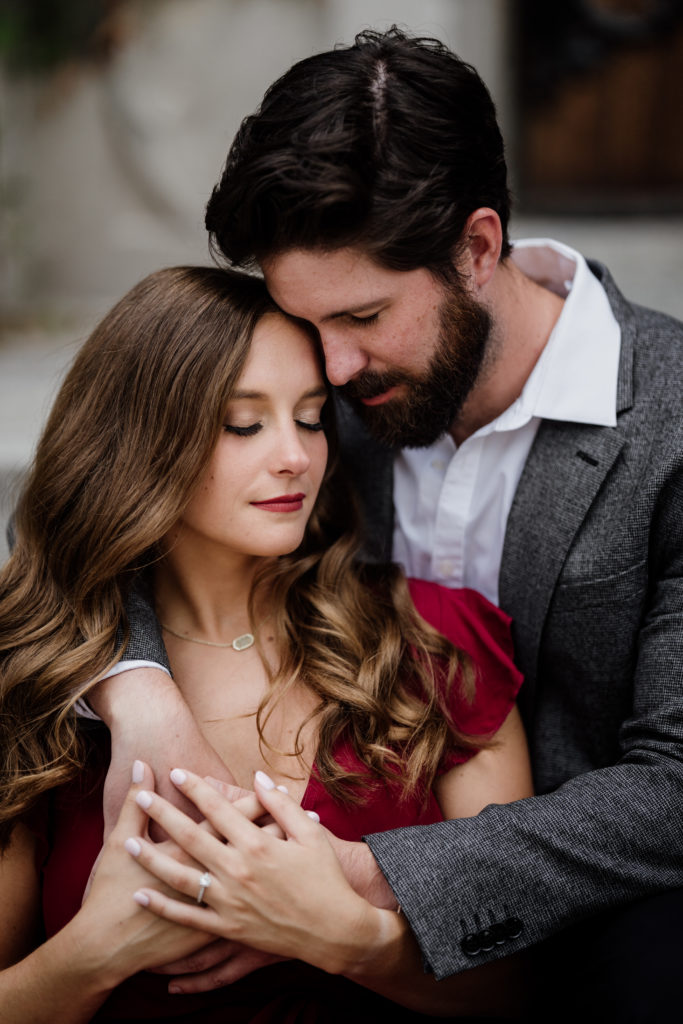 Snuggling Engagement Photo Red Dress