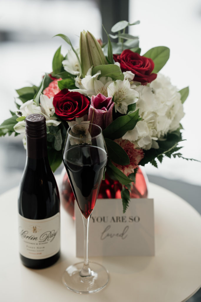 How to prep for a boudoir photo shoot — for example, bringing red wine and a bouquet