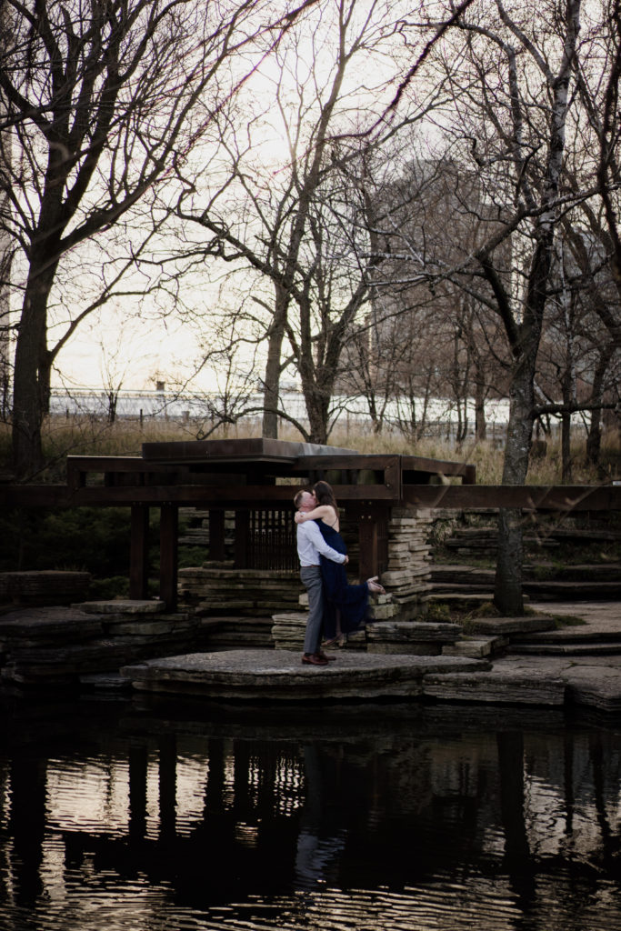 couple kissing at alfred caldwell lily pool in Chicago