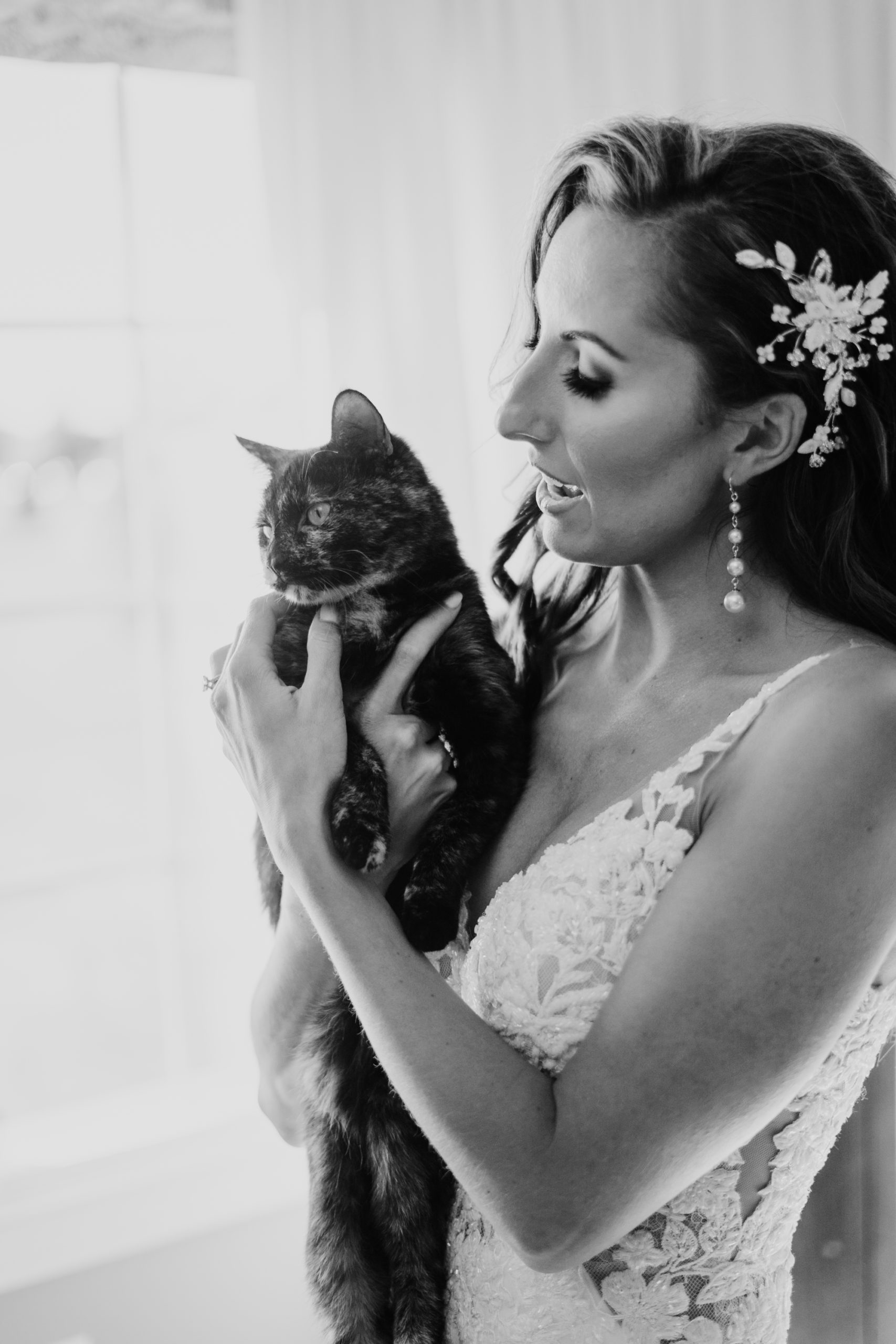 bride and her cat on wedding day